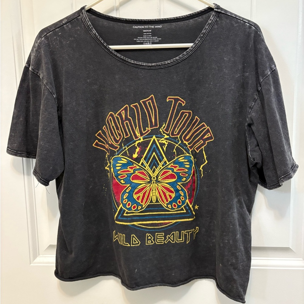 Caution to the Wind World Tour Wild Beauty Graphic Tee. Woman’s Size Medium.